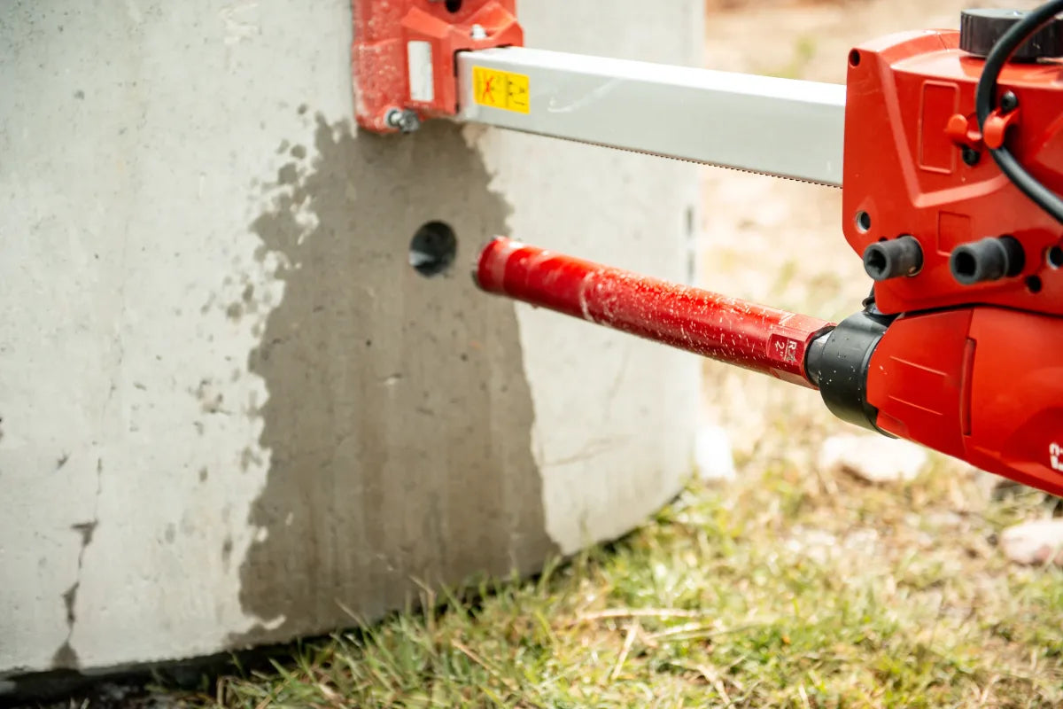 Wet core drilling detail on a concrete jobsite