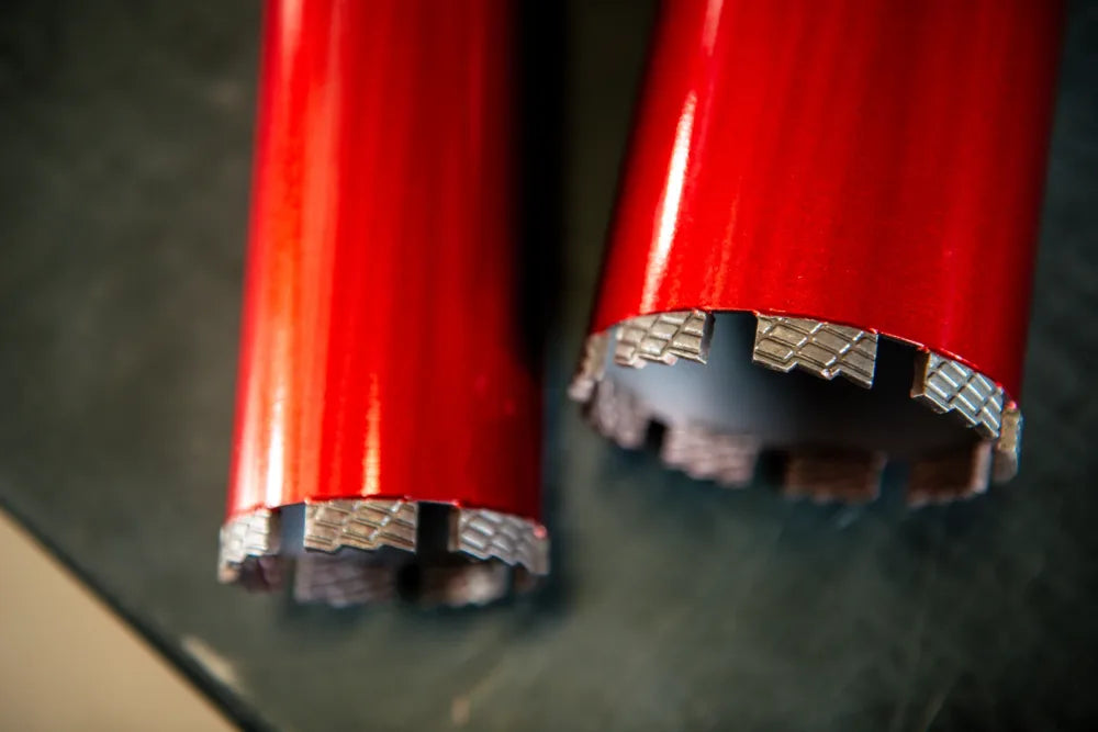 Close view of diamond segments on a red core bit